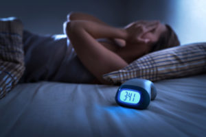 CBD for sleep represented by sleep mask and hemp leaf